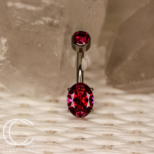 Titanium Oval Cut Navel Curve-Red CZ