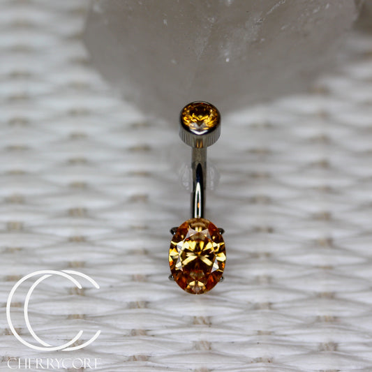 Titanium Oval Cut Navel Curve - Amber Yellow CZ