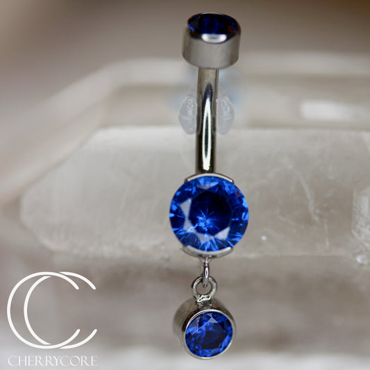 Titanium Partial Bezel Sapphire CZ- Navel Curve w/ Dangle
